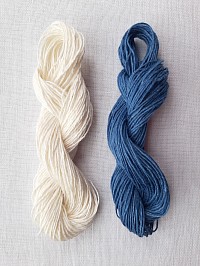 Woad blue dyed linen skein with white linen skein